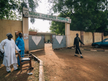 Front entrance of Noma Hospital in Sokoto, north-west Nigeria. It’s the only one in the country dedicated to this neglected and devastating infection. The hospital provides free medical care, including reconstructive surgery, for people affected by noma. It is run by the Ministry of Health and supported since 2014 by Médecins Sans Frontières/Doctors Without Borders (MSF) with a programme of activities for survivors and people affected by noma. Sokoto, Nigeria, April 24 2017.